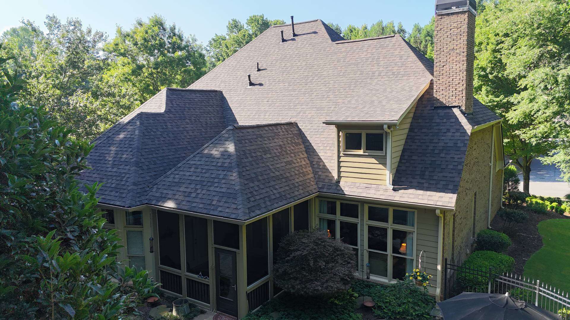 Back of the Suwanee GA home with the new shingle roof over the screened porch