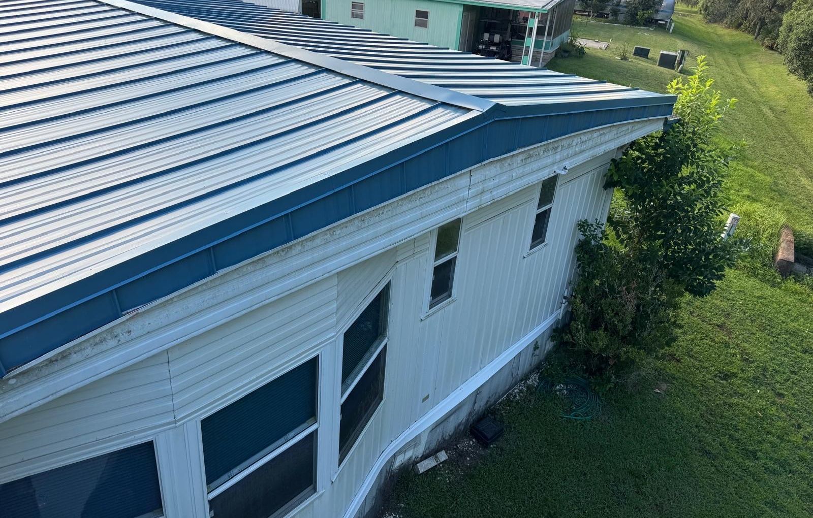 Finished blue standing seam metal roof on a manufactured home in Dade City FL