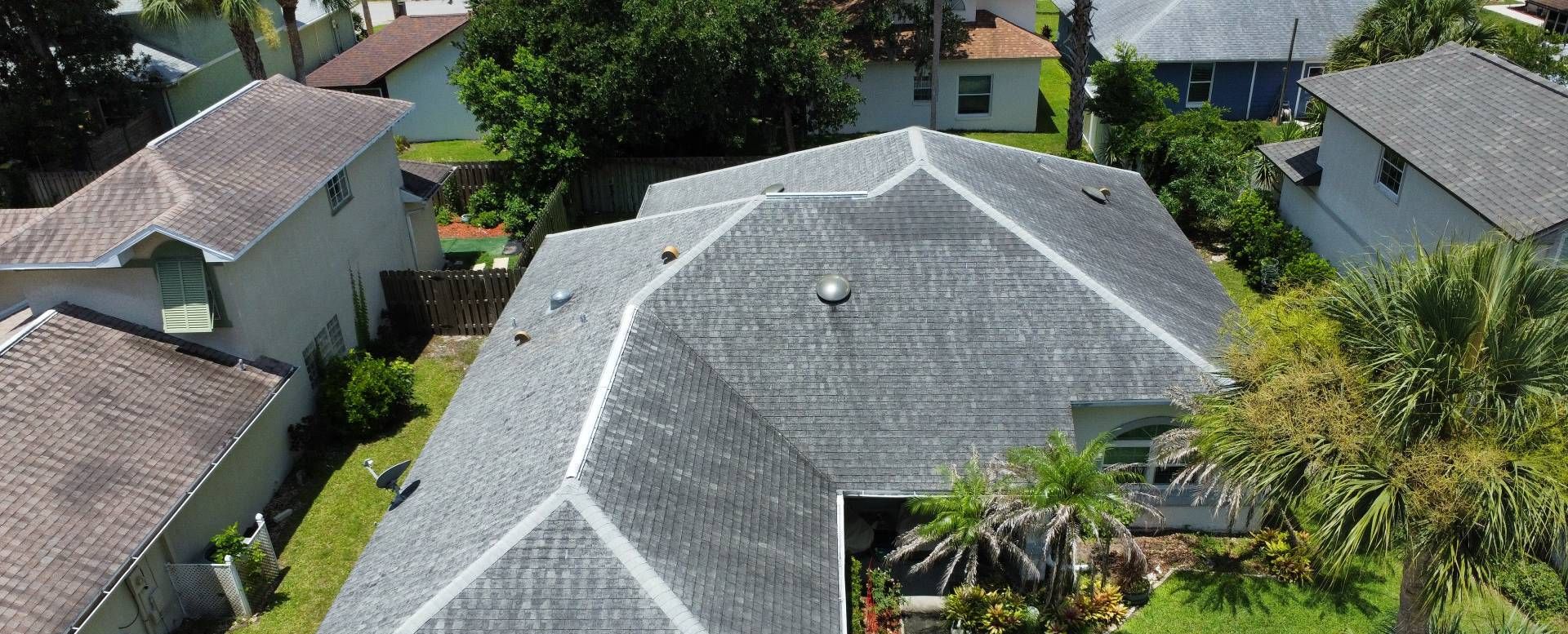 Aerial view of the old gray shingle roof on a ranch home in Port Orange FL