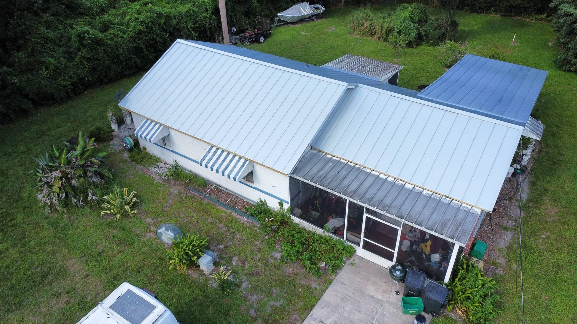 Aerial view of the new standing seam metal roof on the DeBary FL home