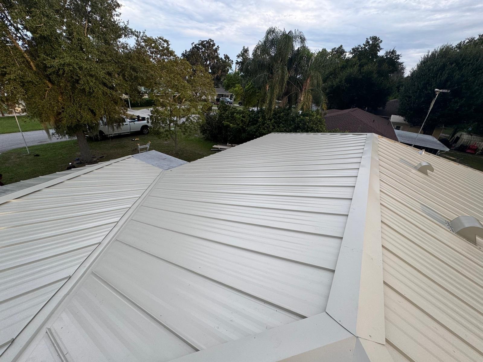 Hip and ridge detail on the new Galvalume standing seam roof in Lake Wales FL