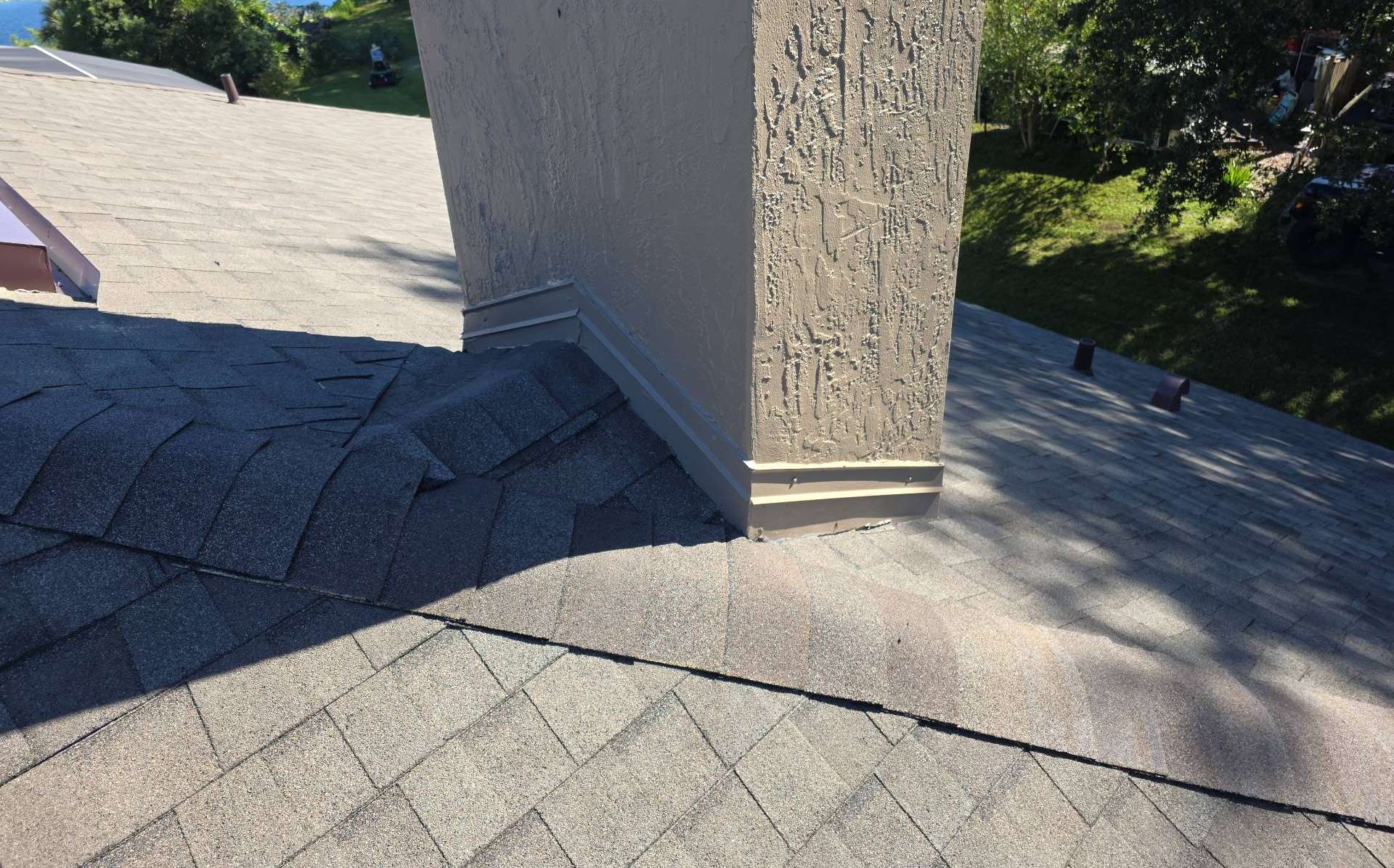 Back side of the chimney on the new shingle roof in Deltona FL